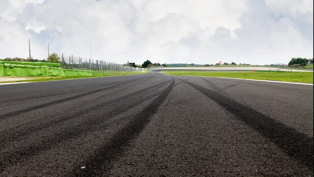 Motor sport race track view black asphalt and skid marks empty straight line, time lapse animation, competition concept