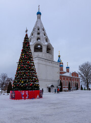 view of the bell tower on the cathedral square in the city of Kolomna in the winter for the holidays,