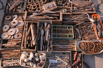 
old circles on the saw. close-up showing old rusty metal and brass parts in bulk for decoration or...