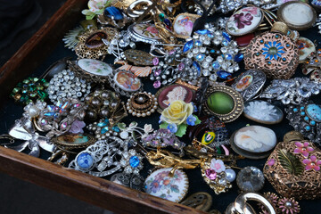 
Showcase of multi-colored natural stone beads. Vintage jewelry at the flea market. Necklaces made...