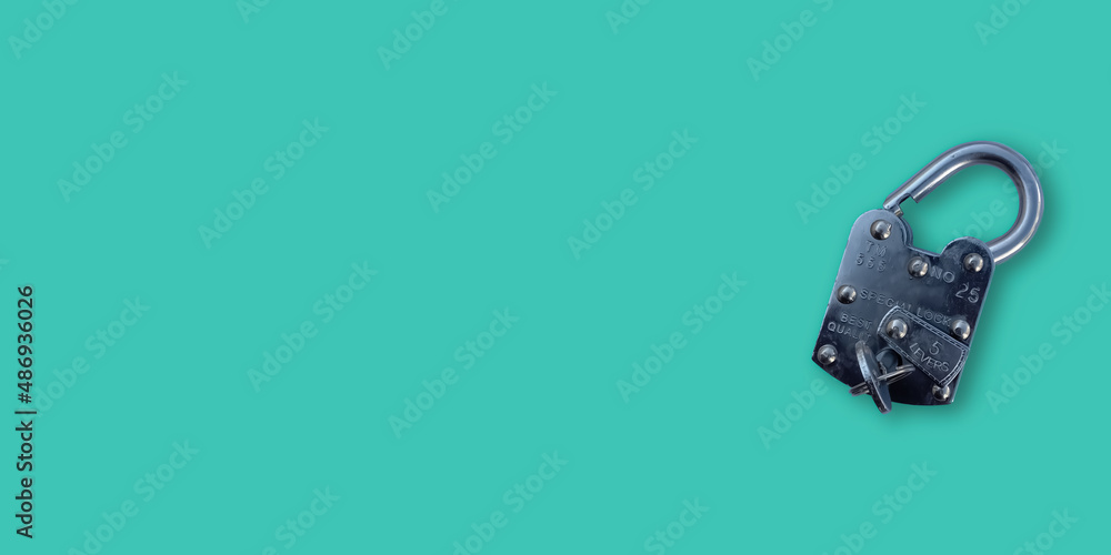 Poster opened iron lock placed on cyan banner with free copy space backdrop. locker with the key on empty p