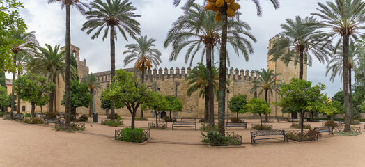 Fototapeta na wymiar Exterior panoramic view at the Alcázar of the Christian Monarchs fortress or Alcázar of Córdoba, a medieval alcázar located in the historic centre of Córdoba, Spain