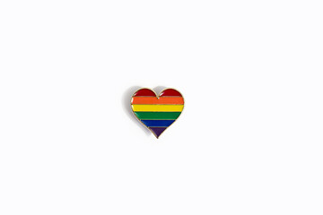 Rainbow heart with shadow on a white background. The concept of lgbt and gender minorities.