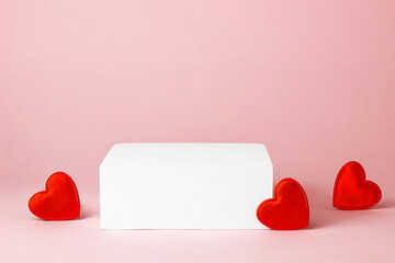 White square podium with red hearts on a pink background. Advertising and product presentation. Valentine's Day and 14 February. Mockup for cosmetics.