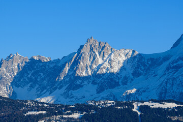The Aiguille du Midi in the Mont Blanc massif in Europe, France, Rhone Alpes, Savoie, Alps, in winter on a sunny day.