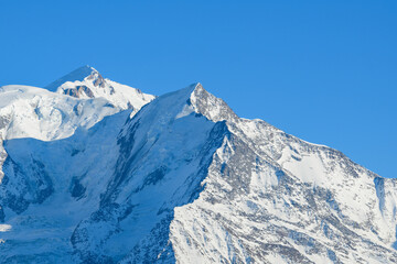 Fototapeta na wymiar The Aiguille de Bionnassay in the morning in Europe, France, Rhone Alpes, Savoie, Alps, in winter, on a sunny day.