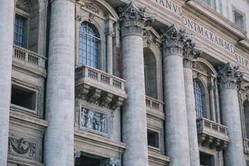 Obraz premium Low angle view of exterior and entrance of Saint Peter's Basilica.