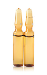 Brown pharmaceutical ampoules with medication on white background