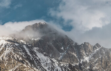 Beautiful winter mountains landscape  High snow covered mountains in the clouds. Georgia, Kazbegi.