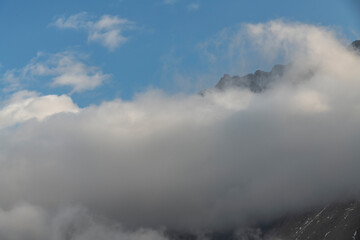 Beautiful winter mountains landscape  High snow covered mountains in the clouds. Georgia, Kazbegi.