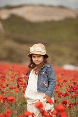Pretty little girl on a poppy field, outdoor © rimmdream