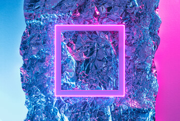 Metallic grunge surface with pink neon frame. Retro futurism abstract background.