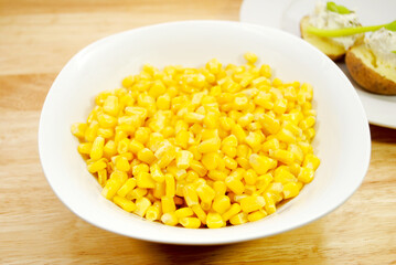 A Side Dish of Sweet Yellow Corn i a White Bowl