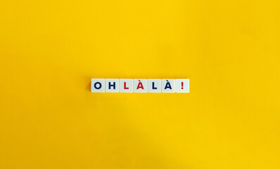 Oh La La French Expression on Letter tiles on Yellow background. Minimal aesthetics.