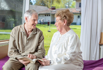 Caucasian seniors smiling at rehab clinic. Retired elderly people living their life at its best.