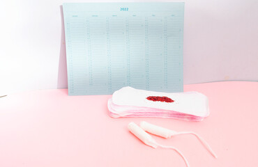Menstrual pad with schedule card background