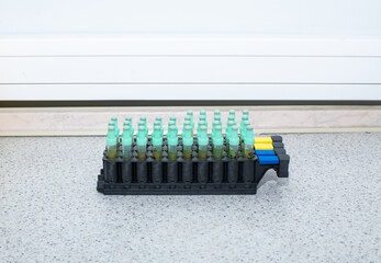 a stand with vacuum tubes with venous blood for analysis, laboratory concept