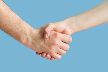 hands of man and woman in struggle for gender equality, female independence, male masculine power, confrontation. feminism concept. international womens day 8 march. handshake