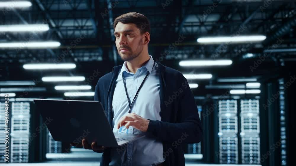Fototapete Successful Data Center IT Specialist Using Laptop Computer. Server Farm Cloud Computing Facility with System Administrator Working. Data Protection Engineering Network for Cyber Security.