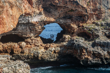 View on rocks with hole and deep blue sea.Mallorca Island, Spain