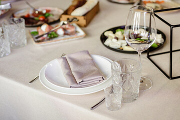 Сatering table with glass stemware at restaurant before party 