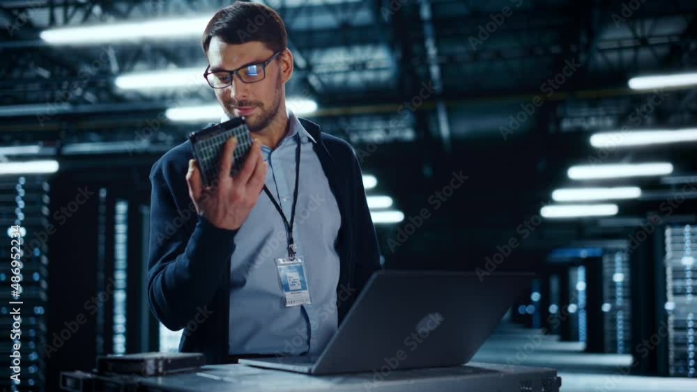 Fototapete Successful Data Center IT Specialist Using Laptop Computer. Server Farm Cloud Computing Facility with System Administrator Working. Data Protection Engineering Network for Cyber Security.