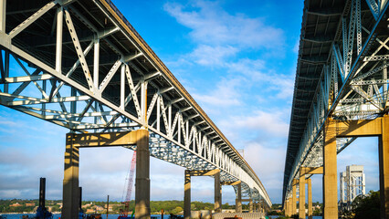 Gold Star Memorial Bridges in New London, Connecticut. Two-lane highway bridges in diminishing perspective, low angle view.