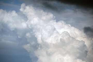 Landscape of dark ominous clouds forming on stormy sky during heavy thunderstorm