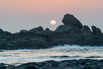 sunset between rock