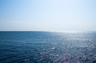 Blue sea water horizon line, sunlight