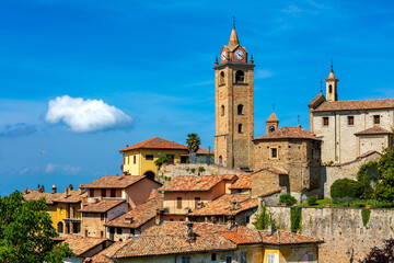Old town of Monforte d'Alba under blue sky in Italy.