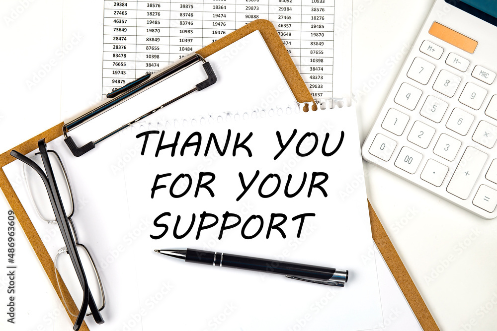 Poster text thank you for your support on the white paper on clipboard with chart and calculator