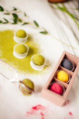 Organic natural candies made of nuts and matcha. chocolate, natural, handmade candies on a white...
