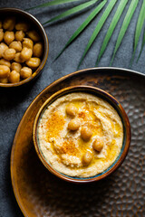Close up of Hummus served in a bowl on a plate
