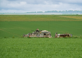 British army Warrior FV510 fighting vehicle with trailer attached in action on a military exercise...