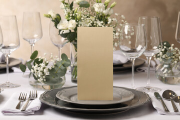 Stylish elegant table setting for festive dinner in restaurant