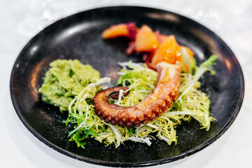 Cooked octopus with fruits and vegetables