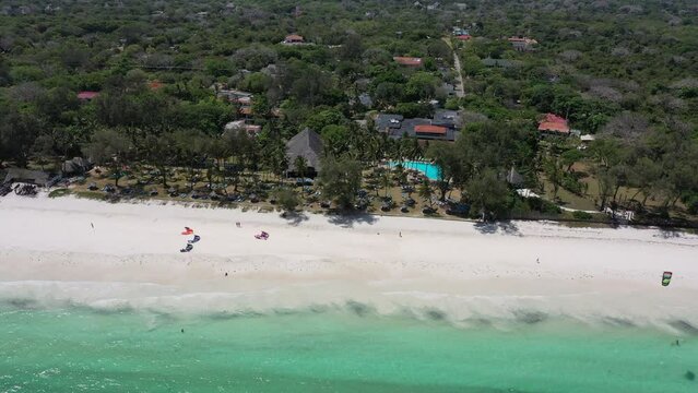 Diani sea resort in diani beach in kenya coast African Sea drone aerial 4k waves blue indan ocean tropical mombasa turquoise white sand East Africa palms paradise view