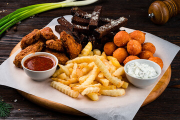 snacks for beer with different sauces on parchment
