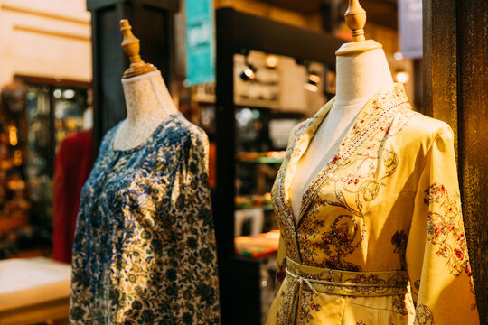 Mannequins dressed in beautiful female woman traditional oriental clothes In store of shopping center. Oriental dress in shop.Popular souvenirs from Dubay, UAE, United Arab Emirates. Shopping in Dubai