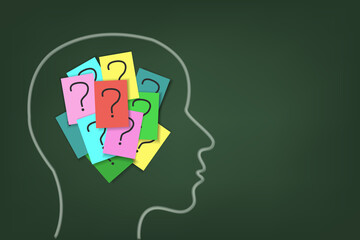 Chalk silhouette of a human head with questions on colored sheets of paper. Vector image on a green background with copy space.