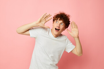 guy with red curly hair posing youth style white t-shirt isolated background unaltered