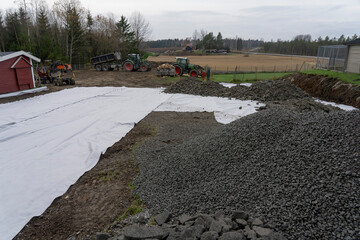 Geotextile lies on a construction site. Strengthening the soil with building tissue.