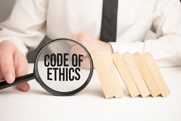 Code of Ethics. Notebook on wood table. Idea presentation, analyze plans.