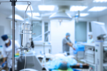 Drop counter with bottle of medicine in operating room. Space for text