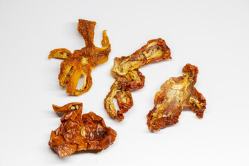 Organic dried tomatoes standing on white background. Natural sun dried tomatoes