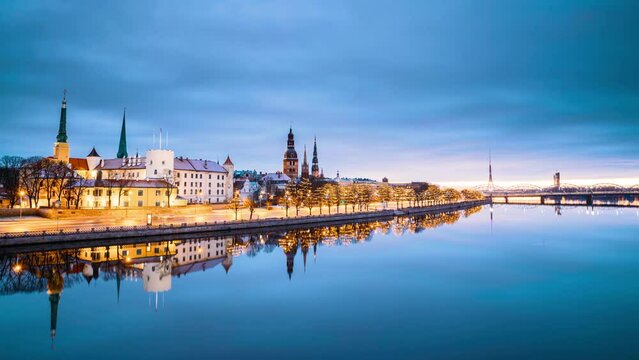 Riga, Latvia, Europe. Time Lapse Timelapse Time-lapse Of Cityscape In Morning Sunrise Time. Night View Of Castle, Dome Cathedral And St. Peter's Church. Popular Place With Famous Landmarks. UNESCO