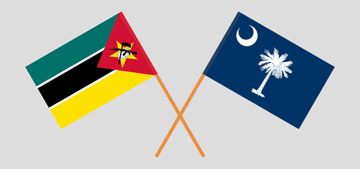 Crossed flags of Mozambique and The State of South Carolina. Official colors. Correct proportion