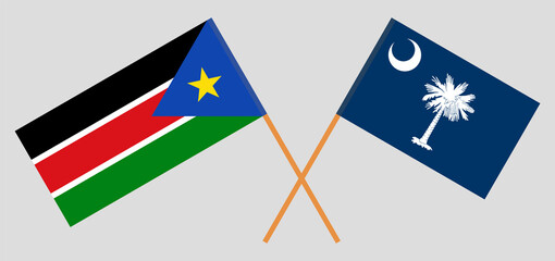 Crossed flags of South Sudan and The State of South Carolina. Official colors. Correct proportion