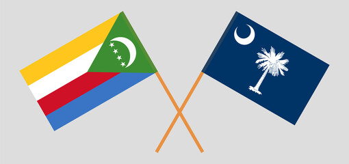 Crossed flags of the Comoros and The State of South Carolina. Official colors. Correct proportion